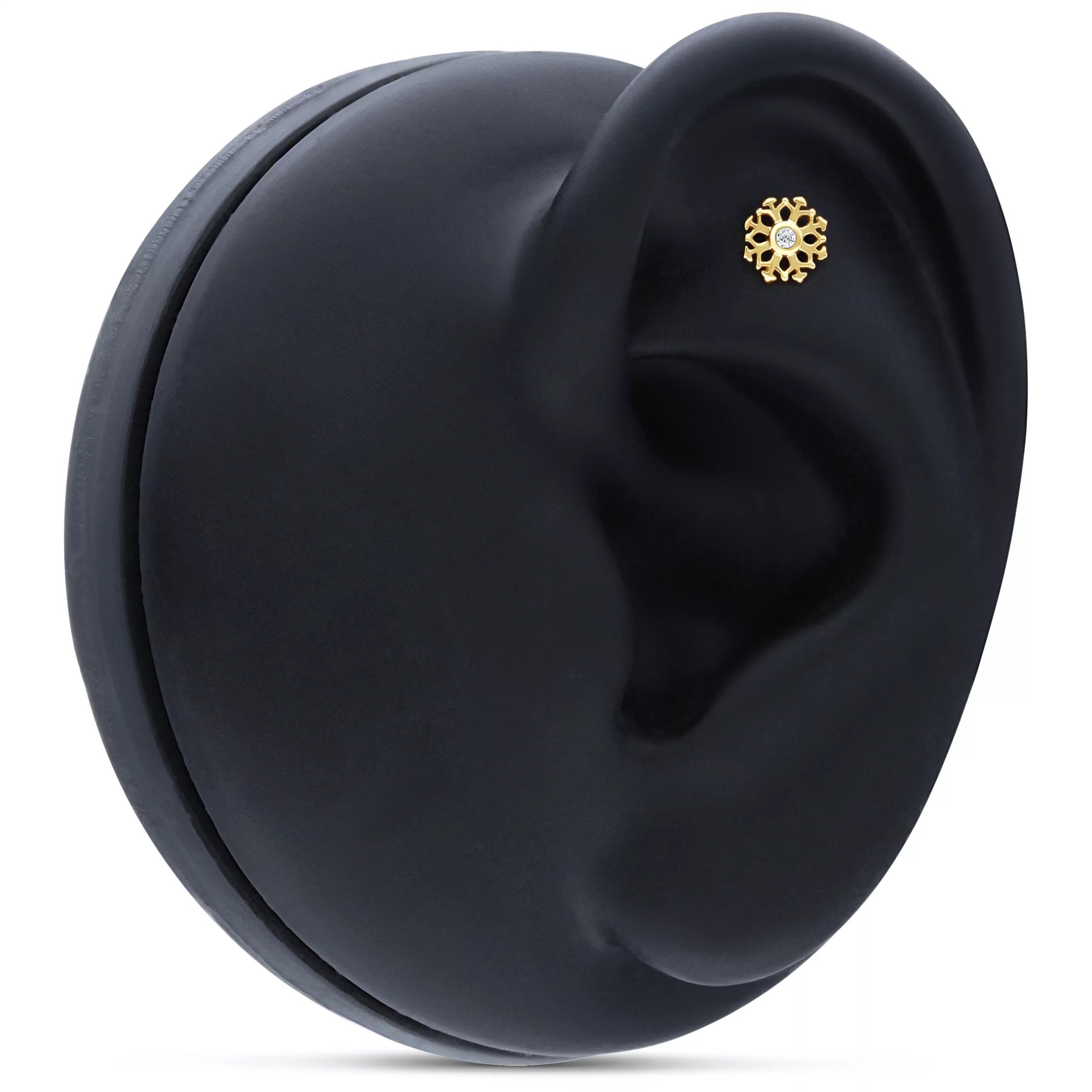 Goldener Schneeflocken-Aufsatz in 14K, getragen an einem schwarzen Ohrmodell