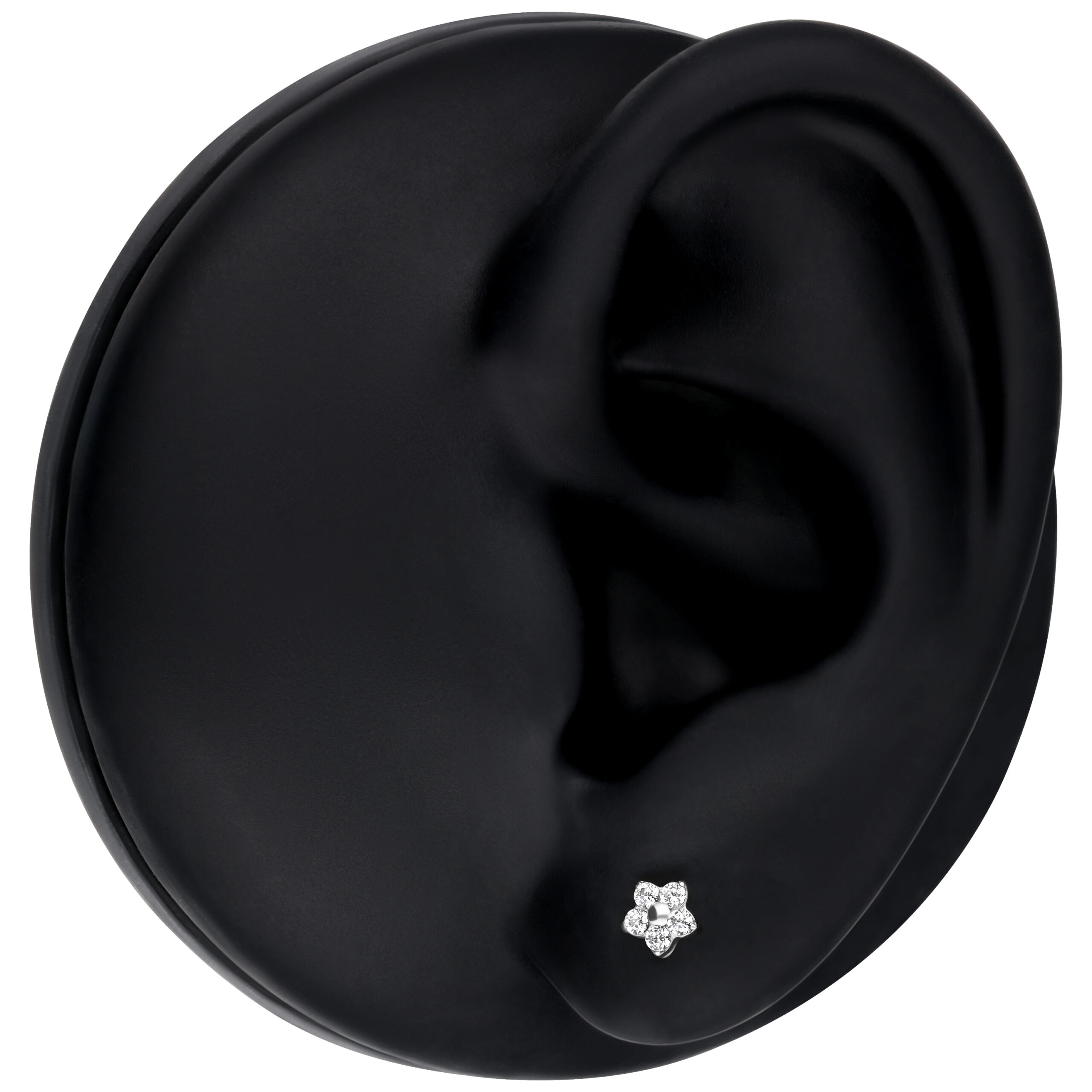 Silberner Blumen-Aufsatz mit kristallklarem Stein auf schwarzem Ohrmodell