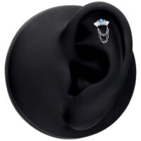 Silberner Push Fit Aufsatz mit Lavendel- und Türkiskristallen auf schwarzem Ohrdisplay