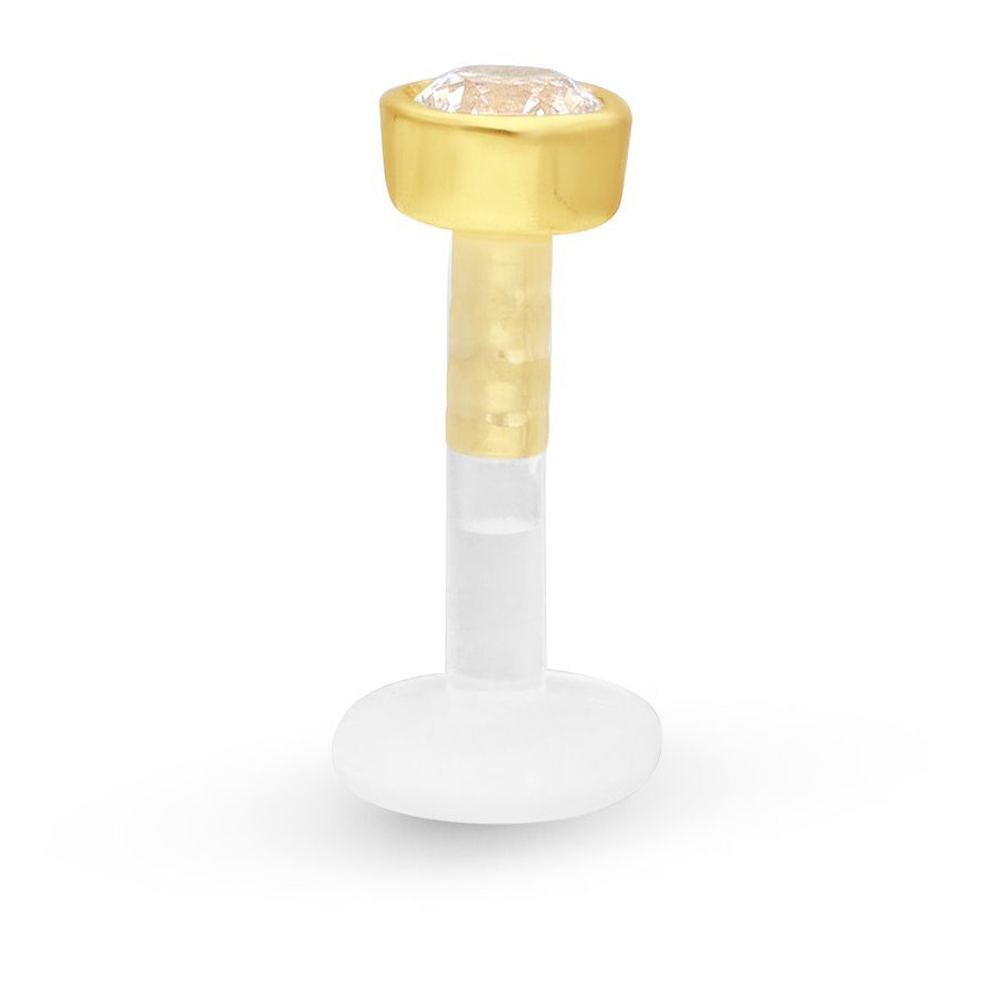 Goldenes Labret mit Kristall auf weißem Hintergrund