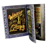 Offenes Buch mit Wildcat Rock'n'Roll Grafik und Voodoo Design
